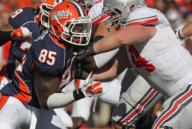 CHAMPAIGN, IL - OCTOBER 15: Whitney Mercilus #85 of the Illinois Fighting Illini rushes against Jack Mewhort #74 of the Ohio State Buckeyes at Memorial Stadium on October 15, 2011 in Champaign, Illinois. Ohio State defeated Illinois 17-7. (Photo by Jonathan Daniel/Getty Images)