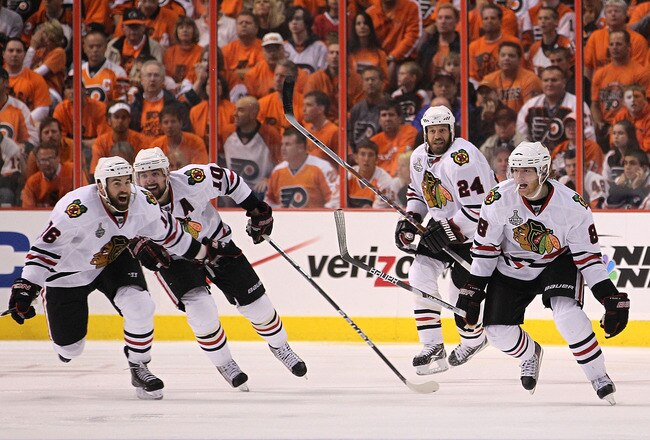 PHILADELPHIA - JUNE 09:  Patrick Kane #88 of the Chicago Blackhawks celebrates with teammates Andrew Ladd #16, Patrick Sharp #10 and Nick Boynton #24 after scoring a goal in overtime to defeat the Philadelphia Flyers 4-3 and win the Stanley Cup in Game Six of the 2010 NHL Stanley Cup Final at the Wachovia Center on June 9, 2010 in Philadelphia, Pennsylvania.  (Photo by Bruce Bennett/Getty Images)