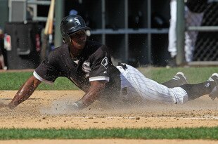 CHICAGO, IL - AUGUST 31:  Juan Pierre #1 of the Chicago White Sox slides across home plate to score a run against the Minnesota Twins at U.S. Cellular Field on August 31, 2011 in Chicago, Illinois. The Twins defeated the White Sox 7-6.  (Photo by Jonathan Daniel/Getty Images)