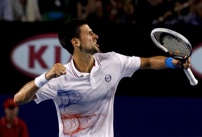 MELBOURNE, AUSTRALIA - JANUARY 27:  Novak Djokovic of Serbia celebrates winning match point in his semifinal match against Andy Murray of Great Britain during day twelve of the 2012 Australian Open at Melbourne Park on January 27, 2012 in Melbourne, Australia.  (Photo by Aaron Favila-Pool/Getty Images)