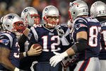FOXBORO, MA - JANUARY 22:  Tom Brady #12 of the New England Patriots celebrates with his teammates after scoring a touchdown in the fourth quarter against the Baltimore Ravens during their AFC Championship Game at Gillette Stadium on January 22, 2012 in Foxboro, Massachusetts.  (Photo by Jim Rogash/Getty Images)