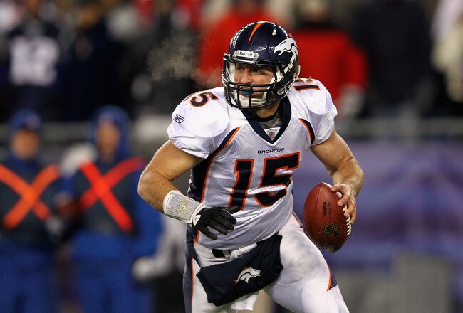 FOXBORO, MA - JANUARY 14:  Tim Tebow #15 of the Denver Broncos looks to pass against the New England Patriots during their AFC Divisional Playoff Game at Gillette Stadium on January 14, 2012 in Foxboro, Massachusetts.  (Photo by Al Bello/Getty Images)