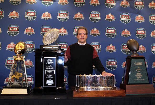 NEW ORLEANS, LA - JANUARY 10:  Head coach Nick Saban of the Alabama Crimson Tide stands next to all the trophies awarded to Alabama as the national champion after defeating Louisiana State University Tigers in the 2012 Allstate BCS National Championship Game during a press conference on January 10, 2012 in New Orleans, Louisiana.  (Photo by Andy Lyons/Getty Images)