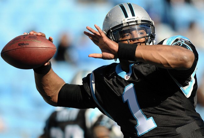 CHARLOTTE, NC - DECEMBER 11:  Quarterback Cam Newton #1 of the Carolina Panthers warms up prior to the game against the Atlanta Falcons at Bank of America Stadium on December 11, 2011 in Charlotte, North Carolina.  (Photo by Jared C. Tilton/Getty Images)
