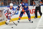 UNIONDALE, NY - NOVEMBER 15: Brandon Dubinsky #17 of the New York Rangers is challenged for the puck by Jay Pandolfo #29 of the New York Islanders during the third period at Nassau Coliseum on November 15, 2011 in Uniondale, New York. (Photo by Christopher Pasatieri/Getty Images)