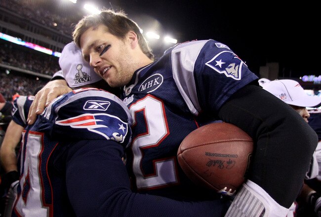 FOXBORO, MA - JANUARY 22:  Tom Brady #12 of the New England Patriots celebrates after defeating the Baltimore Ravens in the AFC Championship Game at Gillette Stadium on January 22, 2012 in Foxboro, Massachusetts. The New England Patriots defeated the Baltimore Ravens 20-23.  (Photo by Elsa/Getty Images)