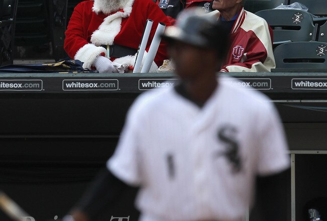 CHICAGO, IL - SEPTEMBER 28:  A fan dressed as Santa Claus watches as Juan Pierre #1 of the Chicago White Sox bats during the last game of the season against the Toronto Blue Jays at U.S. Cellular Field on September 28, 2011 in Chicago, Illinois. The Blue Jays defeated the White Sox 3-2.  (Photo by Jonathan Daniel/Getty Images)