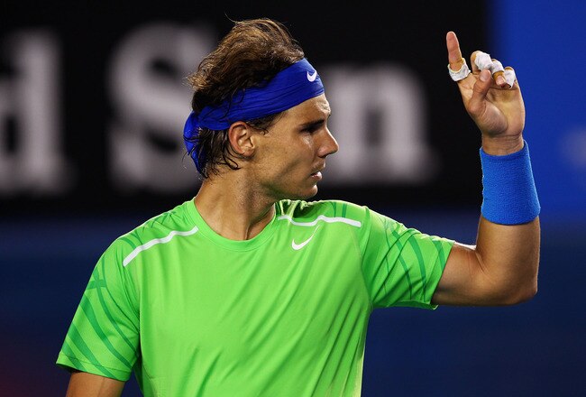 MELBOURNE, AUSTRALIA - JANUARY 26:  Rafael Nadal of Spain challenges a line call in his semifinal match against Roger Federer of Switzerland during day eleven of the 2012 Australian Open at Melbourne Park on January 26, 2012 in Melbourne, Australia.  (Photo by Clive Brunskill/Getty Images)
