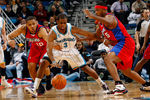 NEW ORLEANS - JANUARY 13:  Chris Paul #3 of the New Orleans Hornets fights to keep the ball away from Eric Gordon #12 and Craig Smith #5 of the Los Angeles Clippers at the New Orleans Arena on January 13, 2010 in New Orleans, Louisiana.  The Hornets defeated the Clippers 108-94.  NOTE TO USER: User expressly acknowledges and agrees that, by downloading and/or using this Photograph, User is consenting to the terms and conditions of the Getty Images License Agreement.  (Photo by Chris Graythen/Getty Images)