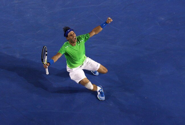 MELBOURNE, AUSTRALIA - JANUARY 26:  Rafael Nadal of Spain celebrates winning his semifinal match against Roger Federer of Switzerland during day eleven of the 2012 Australian Open at Melbourne Park on January 26, 2012 in Melbourne, Australia.  (Photo by Quinn Rooney/Getty Images)