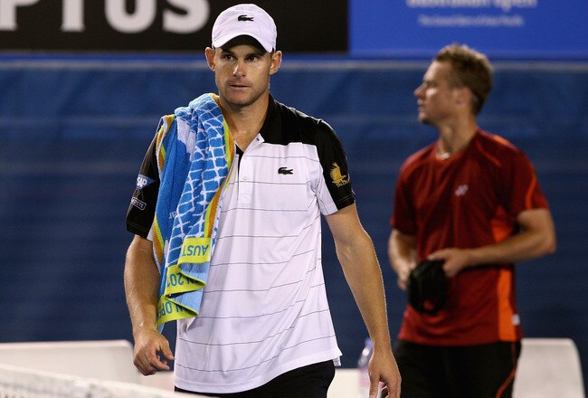 MELBOURNE, AUSTRALIA - JANUARY 19:  Andy Roddick (L) of the USA walks from the court after retiring in his second round match against Lleyton Hewitt of Australia during day four of the 2012 Australian Open at Melbourne Park on January 19, 2012 in Melbourne, Australia.  (Photo by Quinn Rooney/Getty Images)