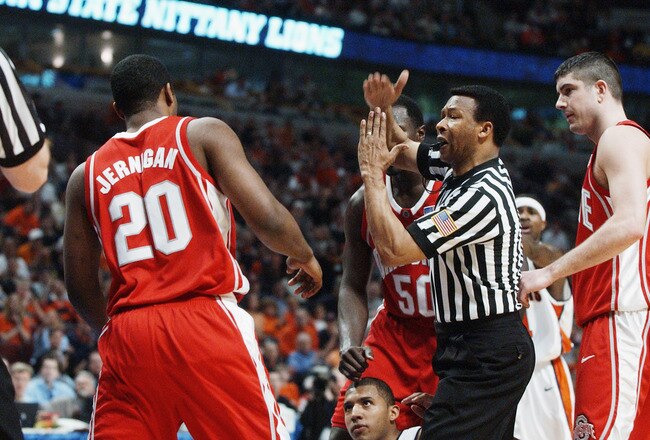 CHICAGO - MARCH 16:  Emonte Jernigan #20 of the Ohio State University Buckeyes is slapped with a technical foul after tangling with Brian Cook #34 of the University of Illinois at Urbana-Champaign Fighting Illini during the Big Ten Men's Basketball Tournament Championship at the United Center on March 16, 2003 in Chicago, Illinois. Illinois defeated Ohio State 72-59.  (Photo by Jonathan Daniel/Getty Images)