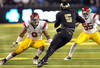 EUGENE, OR - NOVEMBER 19: Defensive end Nick Perry #8 and linebacker Lamar Dawson #55 of the USC Trojans close in on quarterback Darron Thomas #5 of the Oregon Ducksin the third quarter of the game at Autzen Stadium on November 19, 2011 in Eugene, Oregon. USC won the game 38-35. (Photo by Steve Dykes/Getty Images)