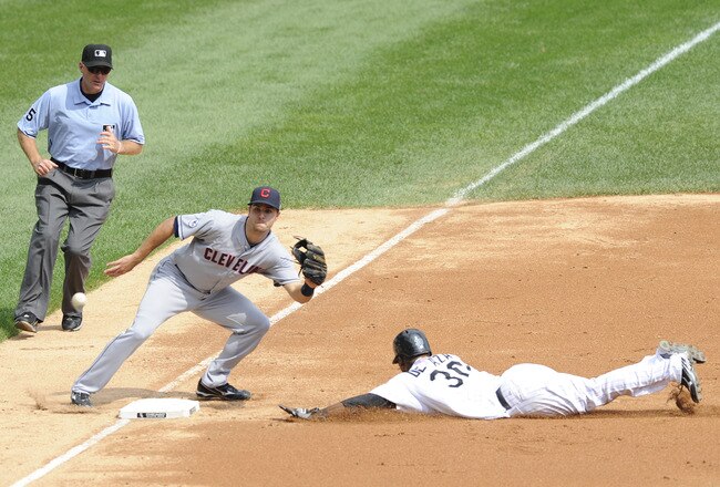 CHICAGO, IL - SEPTEMBER 11: Alejandro De Aza #30 of the Chicago White Sox steals third base as Lonnie Chisenhall #27 of the Cleveland Indians gets the throw on September 11, 2011 at U.S. Cellular Field in Chicago, Illinois.  (Photo by David Banks/Getty Images)