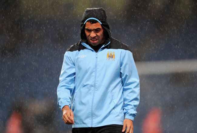 MANCHESTER, ENGLAND - SEPTEMBER 21:  Carlos Tevez of Manchester City warms up in the rain before the Carling Cup Third Round match between Manchester City and Birmingham City at the Etihad Stadium on September 21, 2011 in Manchester, England.  (Photo by Michael Regan/Getty Images)