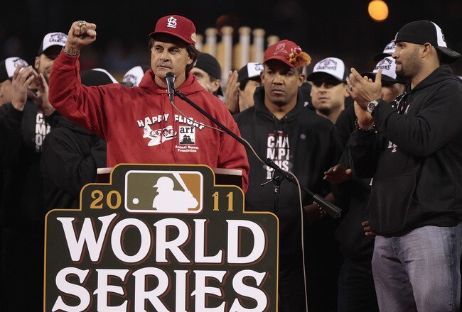 ST. LOUIS, MO - OCTOBER 30: Manager Tony La Russa (L-R) speaks to fans as Octavio Dotel and Albert Pujols of the St. Louis Cardinals look on during a ceremony celebrating the team's 11th World Series championship October 30, 2011 at Busch Stadium in St. Louis, Missouri. (Photo by Whitney Curtis/Getty Images)