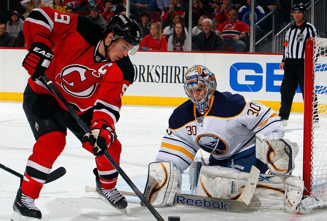 NEWARK, NJ - JANUARY 24:  Goalie Ryan Miller #30 of the Buffalo Sabres makes a save on a shot by Zach Parise #9 of the New Jersey Devils during the second period of an NHL hockey game at Prudential Center on January 24, 2012 in Newark, New Jersey.  (Photo by Paul Bereswill/Getty Images)