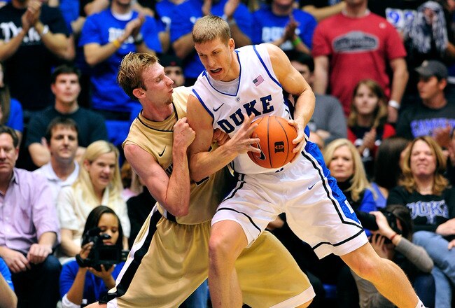 DURHAM, NC - JANUARY 19:  Mason Plumlee #5 of the Duke Blue Devils backs down Nikita Mescheriakov #25 of the Wake Forest Demon Deacons during play at Cameron Indoor Stadium on January 19, 2012 in Durham, North Carolina. Duke won 91-73.  (Photo by Grant Halverson/Getty Images)