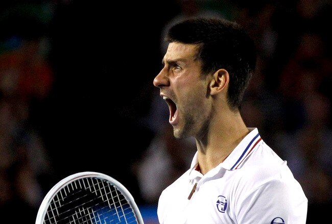 MELBOURNE, AUSTRALIA - JANUARY 27:  Novak Djokovic of Serbia celebrates winning match point in his semifinal match against Andy Murray of Great Britain during day twelve of the 2012 Australian Open at Melbourne Park on January 27, 2012 in Melbourne, Australia.  (Photo by Aaron Favila-Pool/Getty Images)