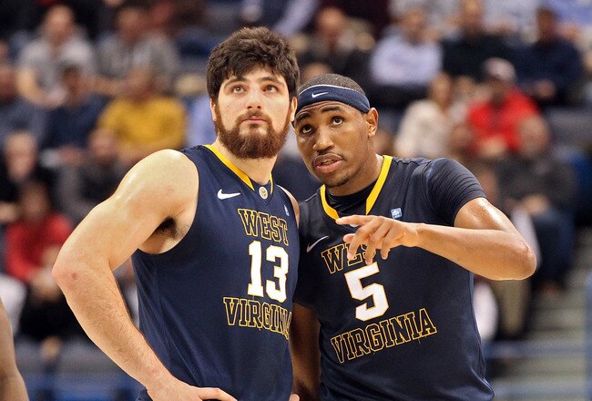 HARTFORD, CT - JANUARY 9:  Deniz Kilicli #13 of the West Virginia Mountaineers chats with Kevin Jones #5 of the West Virginia Mountaineers against the Connecticut Huskies at the XL Center on January 9, 2012,  in Hartford, Connecticut.  (Photo by Jim Rogash/Getty Images)