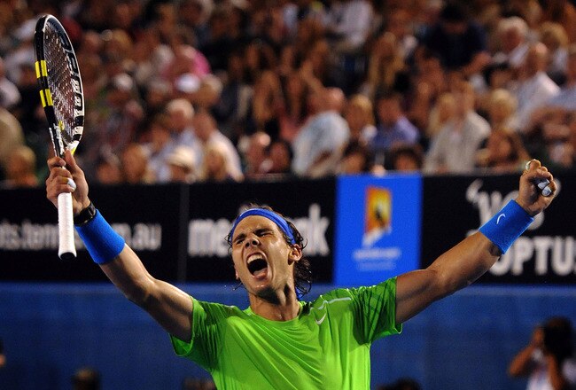 MELBOURNE, VICTORIA - JANUARY 26:  Rafael Nadal of Spain celebrates winning his semifinal match against Roger Federer of Switzerland during day eleven of the 2012 Australian Open at Melbourne Park on January 26, 2012 in Melbourne, Australia.  (Photo by Joe Castro-Pool/Getty Images)