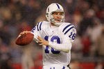 FOXBORO, MA - JANUARY 16:  Quarterback Peyton Manning #18 of the Indianapolis Colts looks to pass against the New England Patriots during the AFC divisional playoff game at Gillette Stadium on January 16, 2005 in Foxboro, Massachusetts.   (Photo by Elsa/Getty Images)