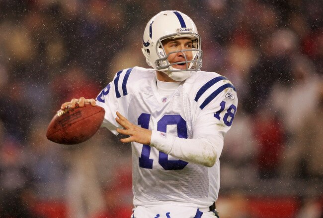 FOXBORO, MA - JANUARY 16:  Quarterback Peyton Manning #18 of the Indianapolis Colts looks to pass against the New England Patriots during the AFC divisional playoff game at Gillette Stadium on January 16, 2005 in Foxboro, Massachusetts.   (Photo by Elsa/Getty Images)