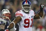 GLENDALE, AZ - FEBRUARY 03:  Defensive end Justin Tuck #91 of the New York Giants reacts after a sack in the second quarter of Super Bowl XLII against the New England Patriots on February 3, 2008 at the University of Phoenix Stadium in Glendale, Arizona.  (Photo by Donald Miralle/Getty Images)