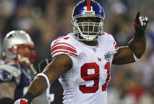 GLENDALE, AZ - FEBRUARY 03:  Defensive end Justin Tuck #91 of the New York Giants reacts after a sack in the second quarter of Super Bowl XLII against the New England Patriots on February 3, 2008 at the University of Phoenix Stadium in Glendale, Arizona.  (Photo by Donald Miralle/Getty Images)