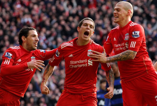 LIVERPOOL, ENGLAND - JANUARY 28:  Daniel Agger of Liverpool celebrates scoring the opening goal with Maxi (L) and Martin Skrtel (R) during the FA Cup Fourth Round match between Liverpool and Manchester United at Anfield on January 28, 2012 in Liverpool, England.  (Photo by Alex Livesey/Getty Images)
