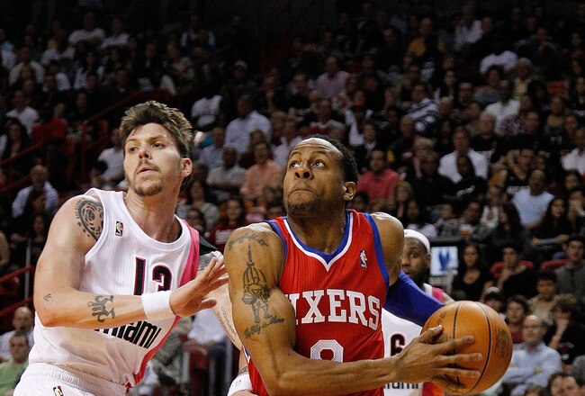 MIAMI, FL - JANUARY 21: Andre Iguodala #9 of the Philadelphia 76ers drives by Mike Miller #13 of the Miami Heat during a game at American Airlines Arena on January 21, 2012 in Miami, Florida. NOTE TO USER: User expressly acknowledges and agrees that, by downloading and/or using this Photograph, User is consenting to the terms and conditions of the Getty Images License Agreement.  (Photo by Mike Ehrmann/Getty Images)