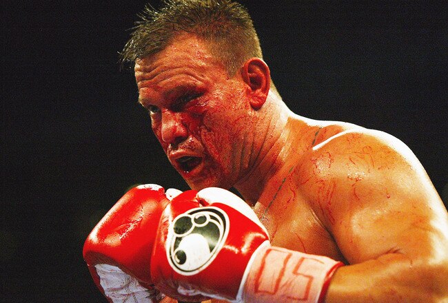 TAMPA, FL - OCTOBER 1:  Bleeding badly from a cut under his left eye, Vinny Maddalone takes on Brian Minto in a Heavyweight bout at the St. Pete Times Forum on October 1, 2005 in Tampa, Florida.  (Photo by Doug Benc/Getty Images)