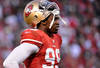 SAN FRANCISCO, CA - JANUARY 14:  Aldon Smith #99 of the San Francisco 49ers looks on during the NFC Divisional playoff game against the New Orleans Saints at Candlestick Park on January 14, 2012 in San Francisco, California.  (Photo by Thearon W. Henderson/Getty Images)