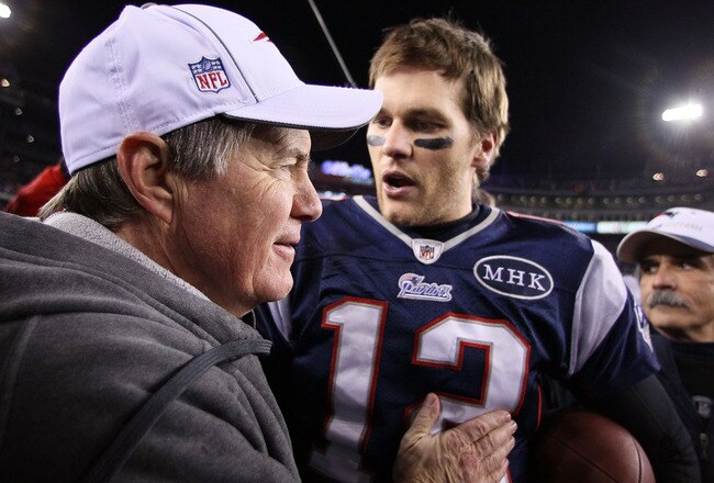 FOXBORO, MA - JANUARY 22:   Tom Brady #12 of the New England Patriots celebrates with head coach Bill Belichick of the New England Patriots after defeating the Baltimore Ravens in the AFC Championship Game at Gillette Stadium on January 22, 2012 in Foxboro, Massachusetts. The New England Patriots defeated the Baltimore Ravens 20-23.  (Photo by Elsa/Getty Images)