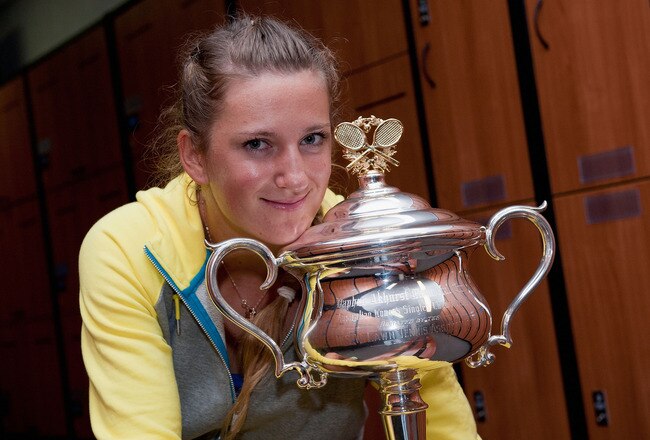 MELBOURNE, VICTORIA - JANUARY 28:  Victoria Azarenka of Belarus poses with the Daphne Akhurst Memorial Cup in the locker room after winning her women's final match against Maria Sharapova of Russia, and being named world number one, during day thirteen of the 2012 Australian Open at Melbourne Park on January 28, 2012 in Melbourne, Australia.  (Photo by Ben Solomon- Pool/Getty Images)