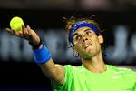 MELBOURNE, AUSTRALIA - JANUARY 24:  Rafael Nadal of Spain serves in his quarter final match against Tomas Berdych of the Czech Republic during day nine of the 2012 Australian Open at Melbourne Park on January 24, 2012 in Melbourne, Australia.  (Photo by Mark Dadswell/Getty Images)