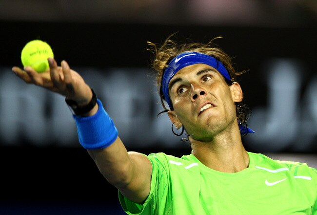 MELBOURNE, AUSTRALIA - JANUARY 24:  Rafael Nadal of Spain serves in his quarter final match against Tomas Berdych of the Czech Republic during day nine of the 2012 Australian Open at Melbourne Park on January 24, 2012 in Melbourne, Australia.  (Photo by Mark Dadswell/Getty Images)