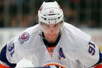 NEW YORK, NY - DECEMBER 26:  John Tavares #91 of the New York Islanders waits for a faceoff in an NHL hockey game against the New York Rangers at Madison Square Garden on December 26, 2011 in New York City.  (Photo by Paul Bereswill/Getty Images)