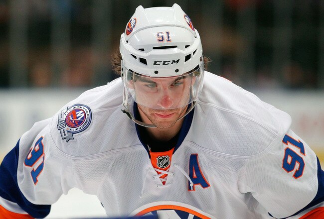 NEW YORK, NY - DECEMBER 26:  John Tavares #91 of the New York Islanders waits for a faceoff in an NHL hockey game against the New York Rangers at Madison Square Garden on December 26, 2011 in New York City.  (Photo by Paul Bereswill/Getty Images)