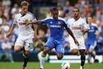 LONDON, ENGLAND - SEPTEMBER 24:  Florent Malouda of Chelsea holds off Mark Gower of Swansea City during the Barclays Premier League match between Chelsea and Swansea City at Stamford Bridge on September 24, 2011 in London, England.  (Photo by Clive Rose/Getty Images)