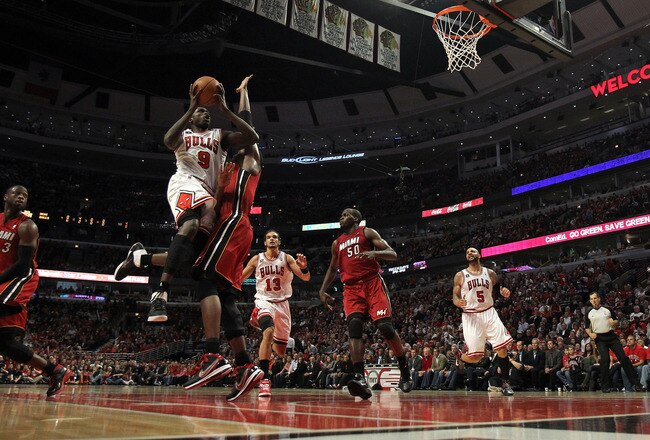 CHICAGO, IL - MAY 26:  Luol Deng #9 of the Chicago Bulls drives for a shot attempt against the Miami Heat in Game Five of the Eastern Conference Finals during the 2011 NBA Playoffs on May 26, 2011 at the United Center in Chicago, Illinois. The Heat won 83-80. NOTE TO USER: User expressly acknowledges and agrees that, by downloading and or using this photograph, User is consenting to the terms and conditions of the Getty Images License Agreement.  (Photo by Jonathan Daniel/Getty Images)