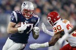 FOXBORO, MA - NOVEMBER 21:   Rob Gronkowski #87 of the New England Patriots carries the ball as  Jalil Brown #30 of the Kansas City Chiefs defends on November 21, 2011 at Gillette Stadium in Foxboro, Massachusetts.  (Photo by Elsa/Getty Images)