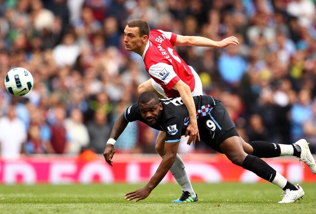 LONDON, ENGLAND - MAY 15:  Thomas Vermaelen (top) of Arsenal in action against Darren Bent of Aston Villa during the Barclays Premier League match between Arsenal and Aston Villa at the Emirates Stadium on May 15, 2011 in London, England.  (Photo by Richard Heathcote/Getty Images)