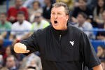 HARTFORD, CT - JANUARY 9:  Bob Huggins of the West Virginia Mountaineers reacts to an official's call during a game with the Connecticut Huskies in the second half at the XL Center on January 9, 2012 in Hartford, Connecticut.  (Photo by Jim Rogash/Getty Images)