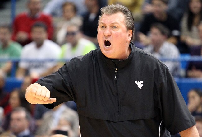 HARTFORD, CT - JANUARY 9:  Bob Huggins of the West Virginia Mountaineers reacts to an official's call during a game with the Connecticut Huskies in the second half at the XL Center on January 9, 2012 in Hartford, Connecticut.  (Photo by Jim Rogash/Getty Images)