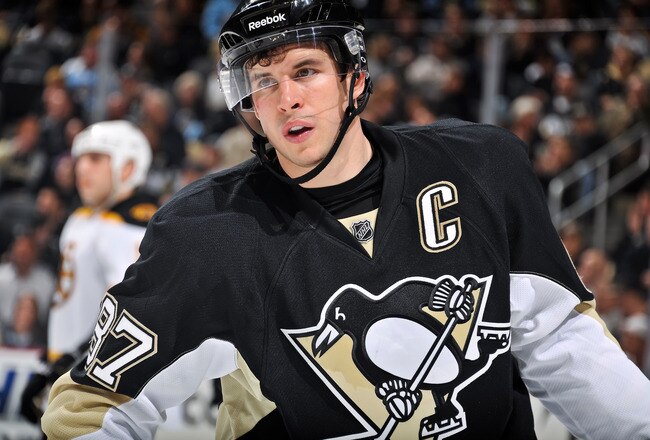 PITTSBURGH, PA - DECEMBER 5:  Sidney Crosby #87 of the Pittsburgh Penguins waits to take a face off against the Boston Bruins on December 5, 2011 at CONSOL Energy Center in Pittsburgh, Pennsylvania.  (Photo by Jamie Sabau/Getty Images)