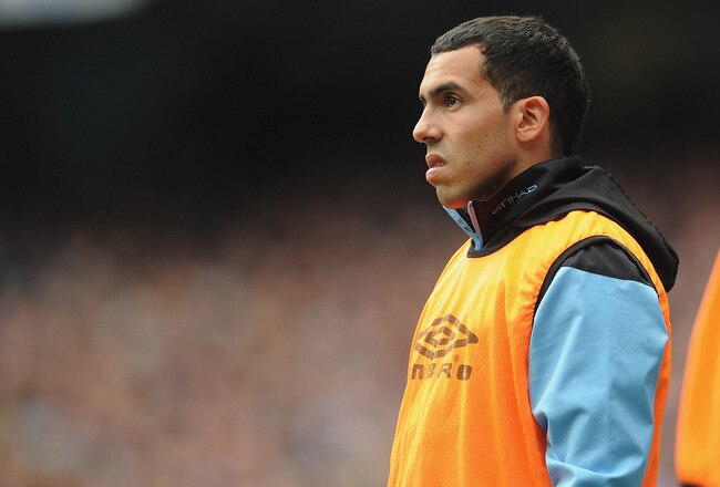 MANCHESTER, ENGLAND - SEPTEMBER 24:  Carlos Tevez of Manchester City looks on from the sidelines during the Barclays Premier League match between Manchester City and Everton at the Etihad Stadium on September 24, 2011 in Manchester, England.  (Photo by Michael Regan/Getty Images)
