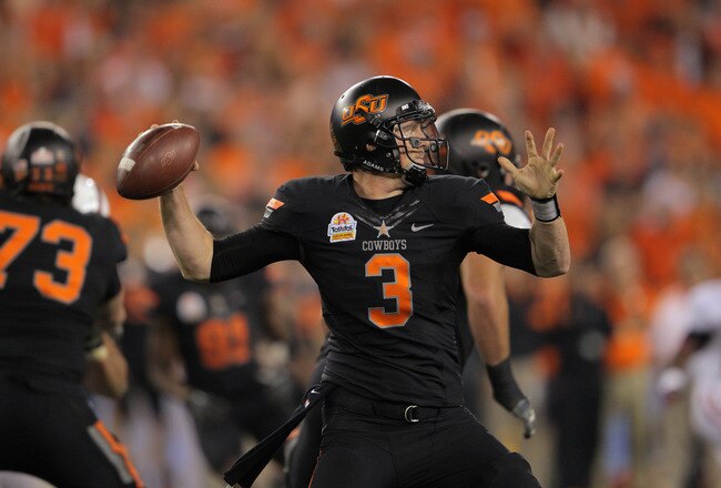 GLENDALE, AZ - JANUARY 02:  Brandon Weeden #3 of the Oklahoma State Cowboys throws a pass against the Stanford Cardinal  during the Tostitos Fiesta Bowl on January 2, 2012 at University of Phoenix Stadium in Glendale, Arizona. Oklahoma State won 41-38 in overtime.  (Photo by Doug Pensinger/Getty Images)