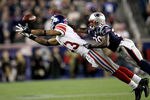FOXBORO, MA - NOVEMBER 6:   Ramses Barden #13 of the New York Giants comes up short against the defense of  Phillip Adams #26 of the New England Patriots at Gillette Stadium in the second half on November 6, 2011 in Foxboro, Massachusetts. (Photo by Jim Rogash/Getty Images)