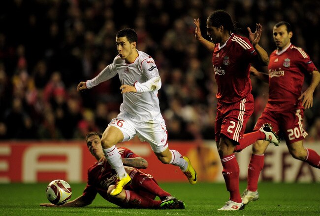 LIVERPOOL, ENGLAND - MARCH 18:  Eden Hazard of Lille breaks clear of the challenges of Daniel Agger and Glen Johnson (R) of Liverpool during the UEFA Europa League Round of 16, second leg match at Anfield on March 18, 2010 in Liverpool, England.  (Photo by Shaun Botterill/Getty Images)